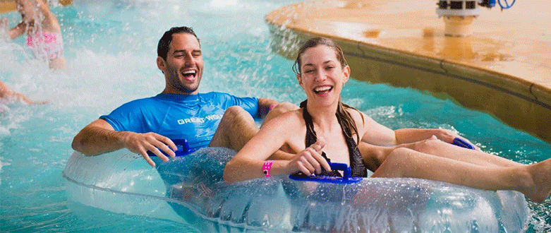 Smiling couple at water park